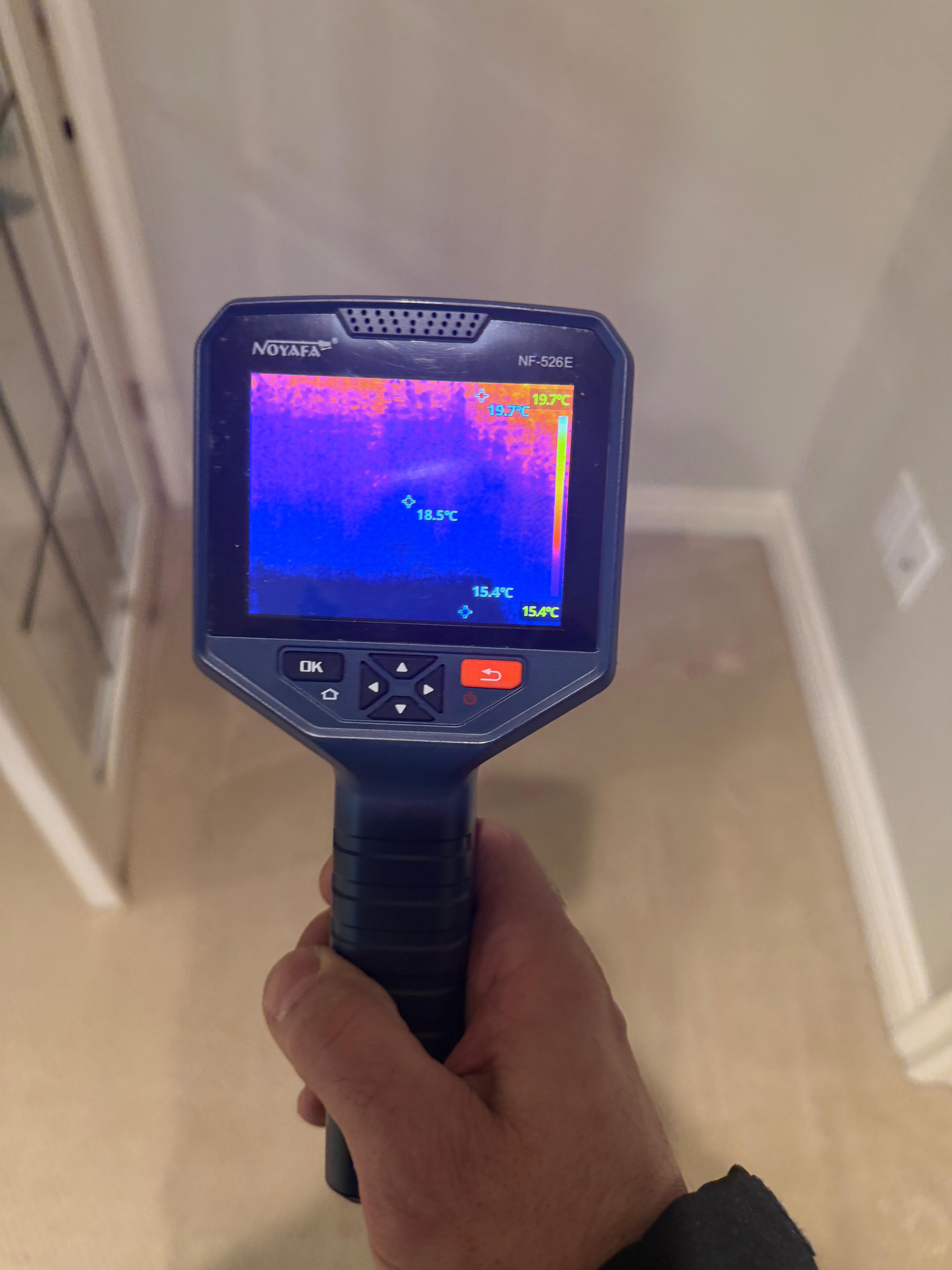 Thermal imaging camera detecting hidden moisture behind a wall during a mold inspection in Toronto — Restoration Professionals